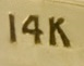 This is an image of a 14 Karat Gold Marking