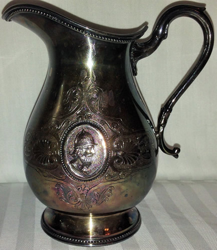 This is an image of a silver plated pitcher.